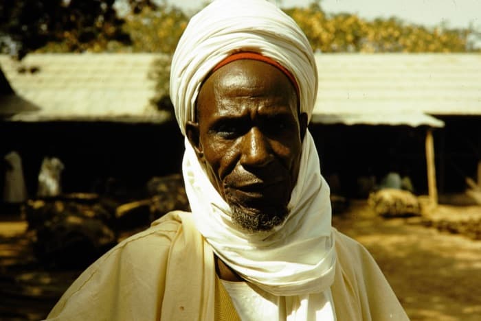 The same sitter, one frame later on the same roll. Northern Nigeria, 1961.